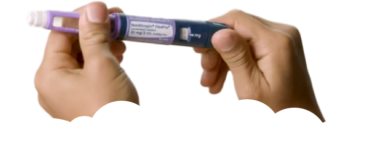 Hands holding a 30 mg purple FlexPro® pen