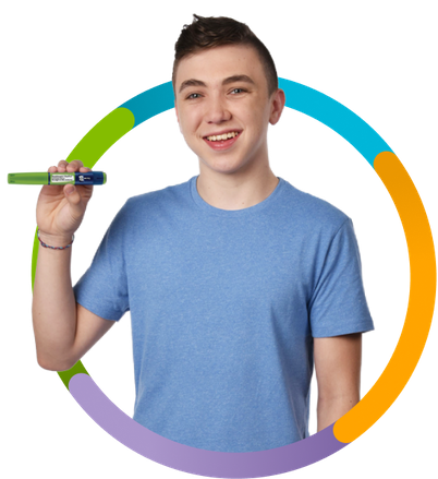 Ayrton smiling holding a Norditropin® pen