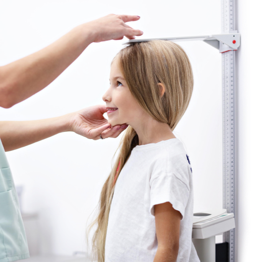 Girl having her height measured